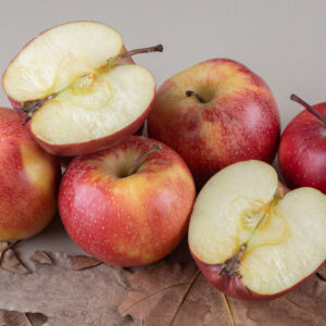 Apple pile and plane tree leaves on marble background. High quality photo